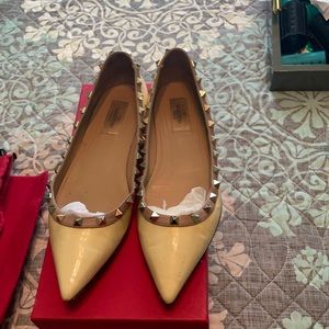 Yellow spike flats by Valentino